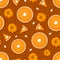 Seamless pattern with pumpkin pies and pumpkins on a wooden background. Vector illustration.