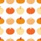 Seamless pattern with pumpkins in Autumn plaid and polka dots