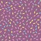 Seamless pattern of purple donut glaze with many decorative sprinkles.