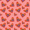 Seamless pattern with rainbow Hearts colored in LGBT flag colors on coral background. Gay pride symbol. LGBT community symbol