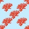 Seamless pattern from red corals sea life on blue