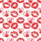 Seamless pattern of red fingerprint hearts and lipstick marks.