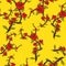 Seamless pattern of red flowers on a yellow background. Sprig of apple blossom