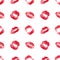 Seamless pattern of red lipstick kiss print on white background isolated, sexy pink lips makeup marks repeating ornament