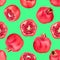 Seamless pattern of red pomegranates on green background isolated close up, whole and cut pomegranate with seeds repeat ornament