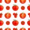 Seamless pattern of red tomatoes on white background isolated closeup, cut and whole cherry tomato repeating ornament, print