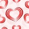 Seamless pattern with red and white dotted hearts