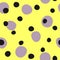 Seamless pattern with repeating round spots. Irregular polka dot. Yellow, purple, black.