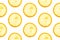 Seamless pattern from round transparent slices of ripe juicy yellow lemon on white background. Poster banner template backdrop