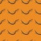 Seamless pattern with sickle,hoe on orange background