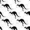 Seamless pattern with silhouettes of kangaroos