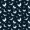 Seamless pattern: silhouettes of white birds eagles and bird nests on a dark background.