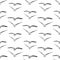 Seamless pattern of sketches flying seagulls