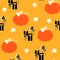 Seamless pattern with skulls, gifts and pumpkin. Halloween texture.