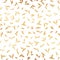 Seamless pattern with small gold leaves on a white background