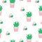 Seamless pattern with smiling cactus flowers in pink and green colors