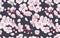 Seamless pattern spring flowers fruit trees on dark background.