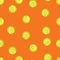 Seamless pattern of tennis balls on an orange background