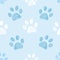 Seamless pattern for textile design. Blue and white colored paw print pattern