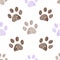 Seamless pattern for textile design. Seamless brown and lilac colored paw print