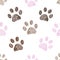 Seamless pattern for textile design. Seamless brown and pink colored paw print