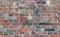 Seamless pattern, texture, brick wall, Texture with different colored bricks, red, green, gray, brown with light reflections