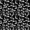 Seamless pattern. Thin delicate twigs with decorative leaves on black  background. Luxurious texture