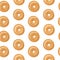 Seamless pattern, top view of fresh bagels with white and brown sesame seeds, white background. Vector illustration.