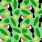 Seamless pattern with toucan, palm leaves and flower