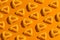 Seamless pattern of triangle crunchy corn cheese flavor snack on orange background.