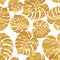 Seamless pattern of tropical gold monstera leaves