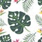 Seamless pattern of tropical leaves of monstera, fern and exotic flowers of royal strelitzia on a white background