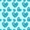 Seamless pattern of turquoise heart made of buttons