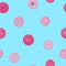 Seamless pattern with various pink clothing buttons on a blue background. Hand-drawn.