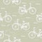 Seamless pattern with vintage bicycles on green background. Vector illustration.