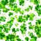 A seamless pattern with watercolor drawings of shamrocks, Irish clovers