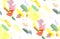 Seamless pattern of watercolor stains: yellow, rose, green blotches on a white background