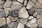 Seamless pattern on weathered, aged rocks, pebbles and stone bricks. 3d illustration