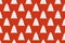 Seamless pattern of white clay Christmas tree toys in the form of Christmas trees on red background.