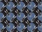 Seamless pattern of white contour rabbits dressed in striped pants and polka dot sweaters on a black background with blue circles.