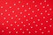 Seamless pattern. White hearts on red background. Top view. Valentine`s Day. Love, date, romantic concept