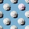 Seamless pattern is a white marshmallow or meringue and one pink marshmallow isolated on a classic blue background