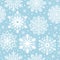 Seamless pattern with white snowflakes on blue background. Winter background for Christmas, Noel, New Year