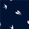Seamless pattern with white swallow birds on a dark blue background