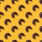 Seamless pattern wiht bitten glazed chocolate donuts, yellow background. Confectionery banner