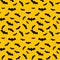 Seamless pattern yellow background with black endless bat on halloween festive