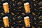 seamless pattern with yellow beer mugs on black background