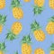 Seamless pattern of yellow pineapples on a blue background.