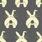 Seamless pattern with yellow rabbits and hares. Design for wallpaper, textiles, Easter background