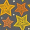 Seamless pattern of yellow unusual stars of different sizes